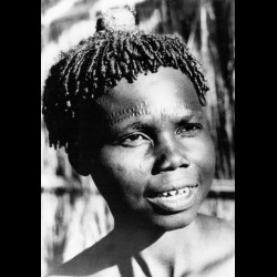 Young boy with scarification and traditional Pende hairstyle.