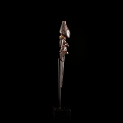 Early Luba wooden comb featuring a finely carved female figure and exceptional sculptural quality.