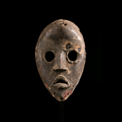 Dan african art mask with large round eyes and open mouth from Côte d’Ivoire or Liberia