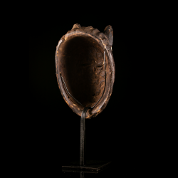 Rear view of a Metoko wooden mask with its custom display stand included.