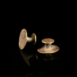Pair of antique bronze ear ornaments, probably Lobi or Akan, traditional West African tribal jewelry.
