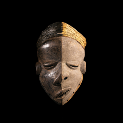 Antique Pende Mbangu mask from the Democratic Republic of the Congo, African disease mask with black and white polychrome.