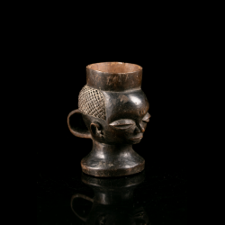 Early Pende wooden palm wine cup – detailed view of the diamond-patterned hairstyle, sculptural handle and dark aged patina.