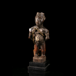 Kongo Nkisi power figure with abdominal charge and cowrie shell – three-quarter view