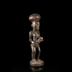 African Chokwe Luena maternity figure with large incised coiffure in three-quarter view
