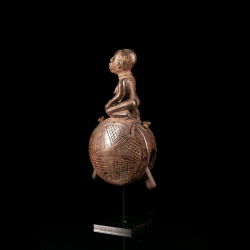 Kongo Dibu wooden bell with geometric carving three-quarter view