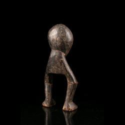 Rear view of an old wooden Lega Katanda-type initiation figure from the Democratic Republic of the Congo.