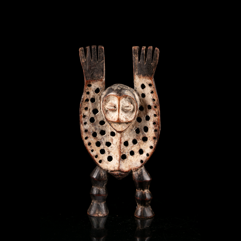 Lega Katanda Bwami figure with raised arms and perforated body