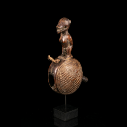 Kongo Dibu ritual bell with engraved geometric decoration and carved figure