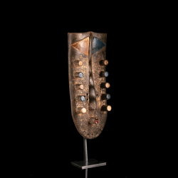 Geometric Grebo mask in carved wood and pigments – three-quarter view