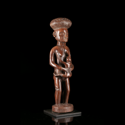 Chokwe Luena female figure with child and elaborate geometric headdress