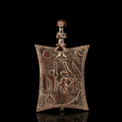 Luba memory board from the DRC with carved symbolic motifs and seated female figure