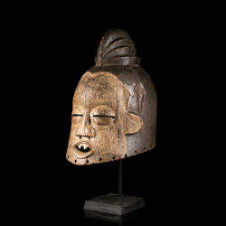 Suku Hemba mask with sculpted coiffure and pale kaolin face, side view